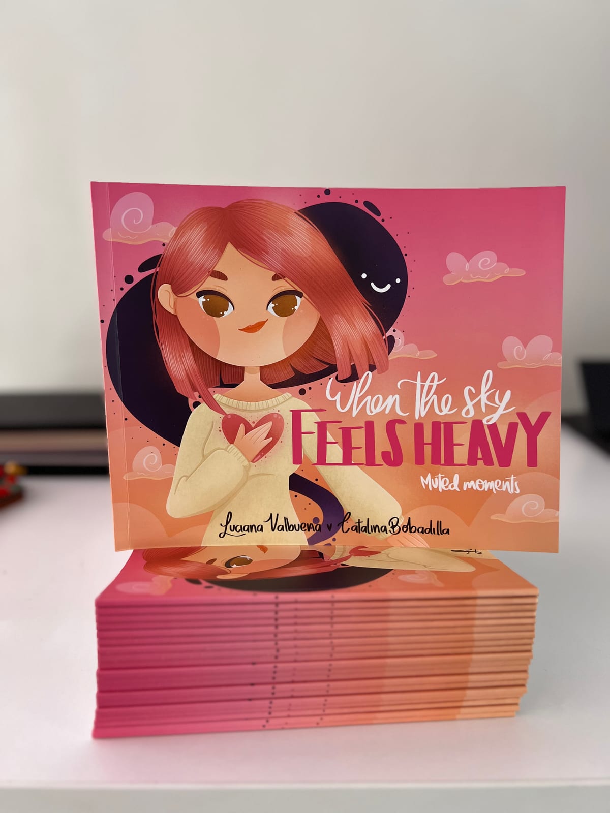 A stack of copies of the book